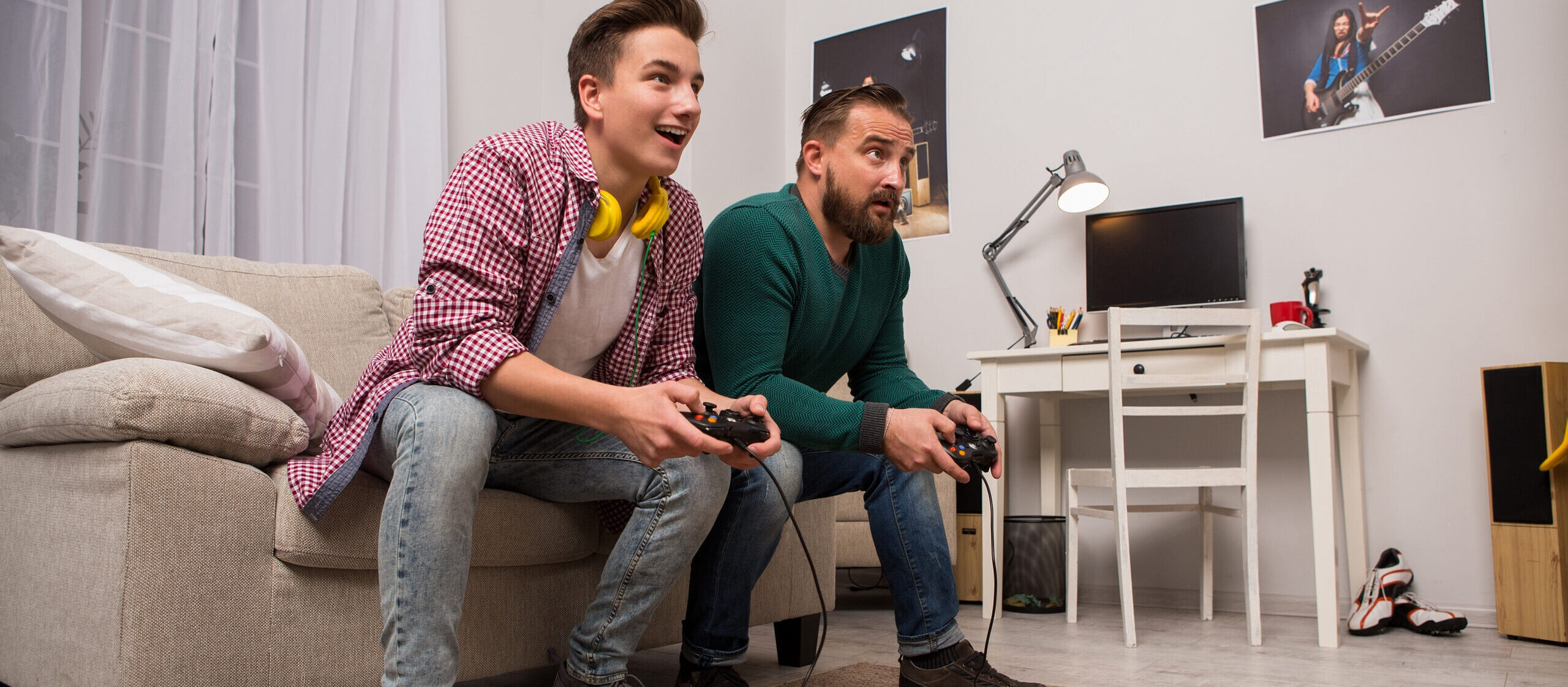 Dad and son playing video game